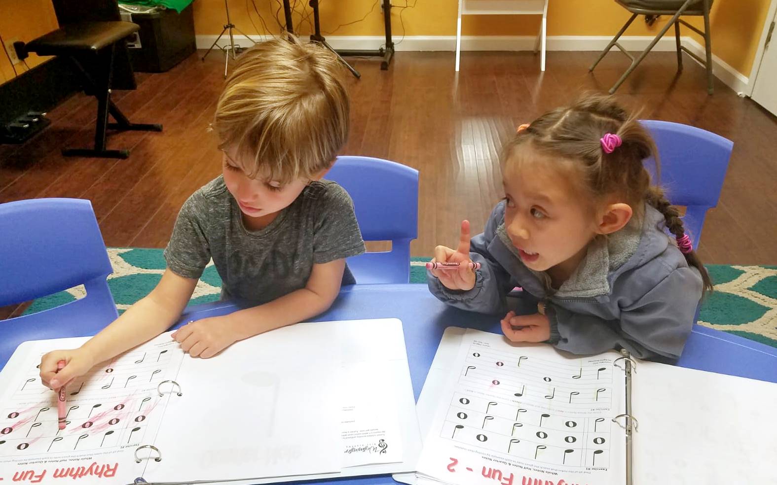Toddlers learning music theory with colorful teaching tools at Westminster Arts Academy