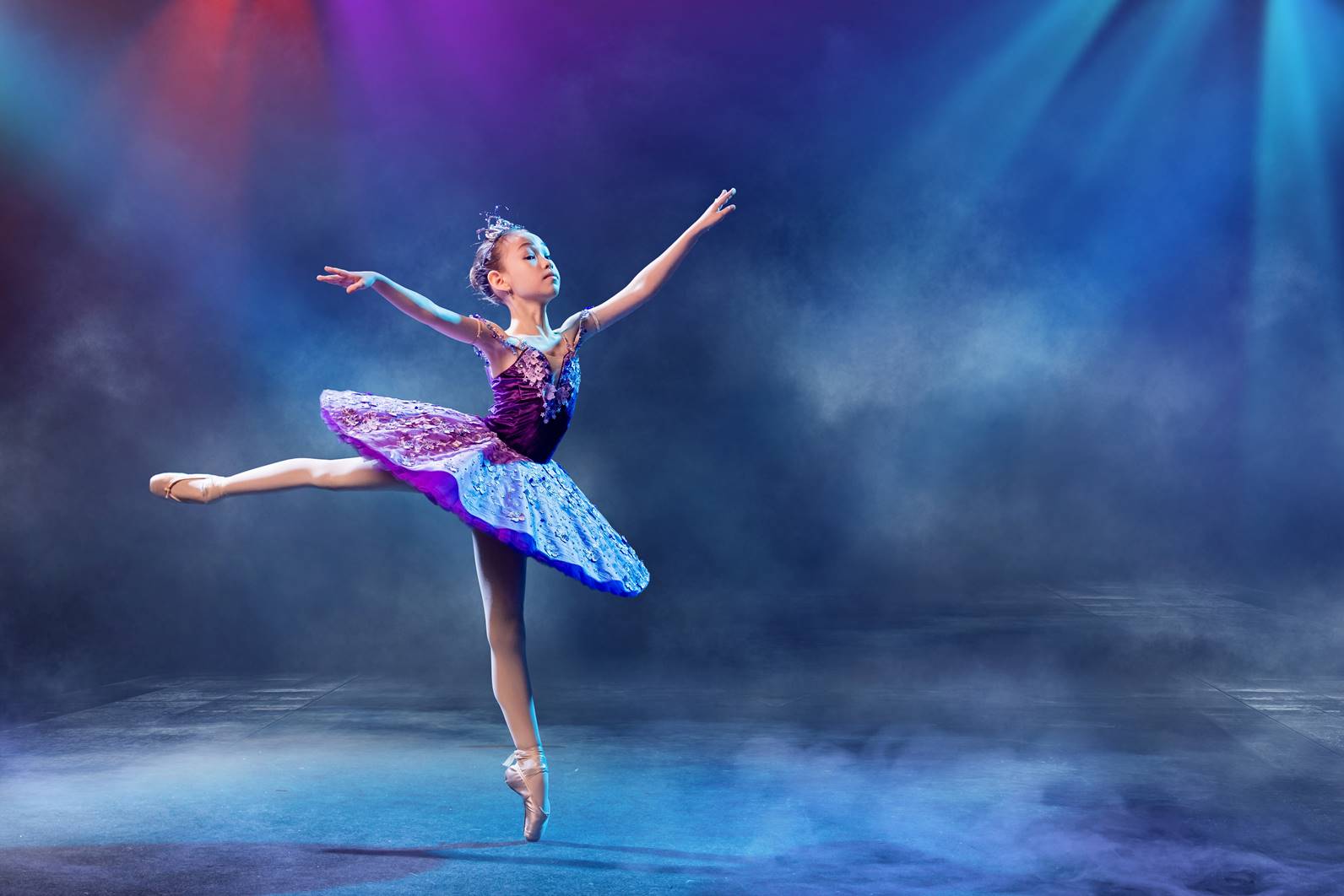 Ballet instructor teaching creative movements to students in Westminster, CA