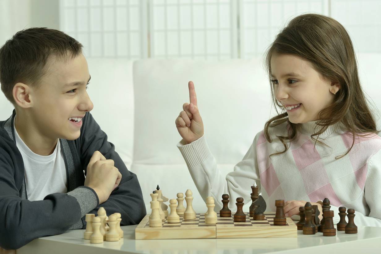 Chess club members analyzing game strategies during a match