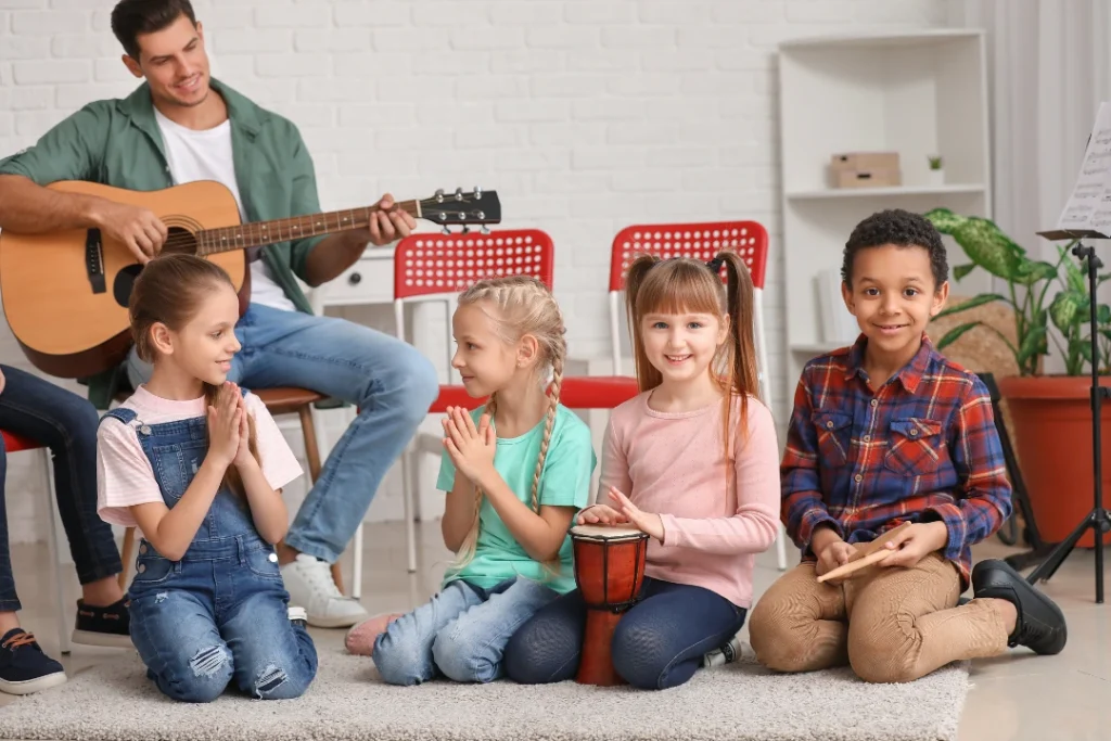 Children exploring different musical instruments in a classroom, practicing rhythm and focus through interactive lessons