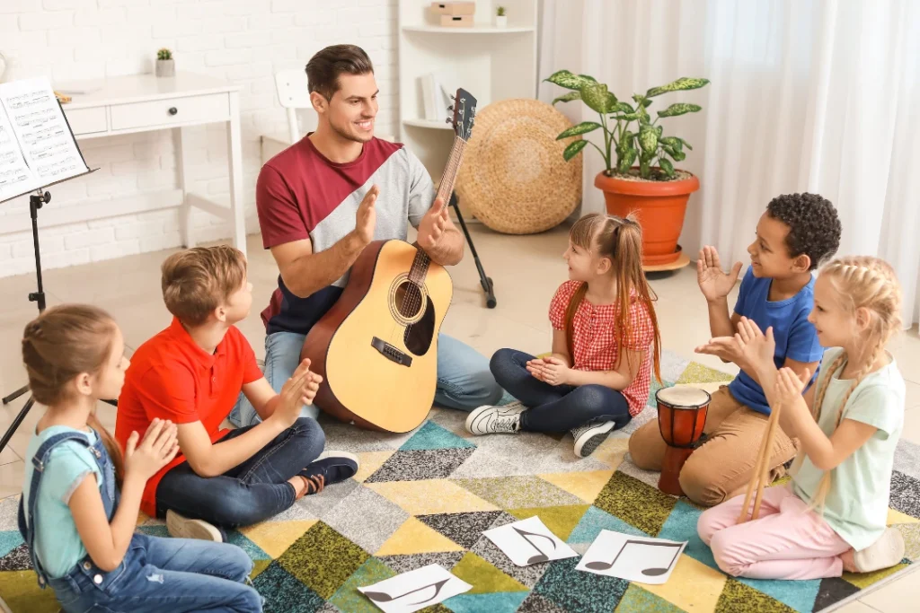 Young students participating in a group music class, using guitar instruments and engaging in fun hands-on activities